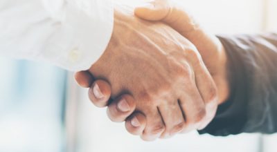 Business partnership meeting. Picture businessmans handshake. Successful businessmen handshaking after good deal. Horizontal, blurred